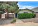 Well-maintained front yard with mature landscaping, a pathway, and charming curb appeal at 3015 Duneville St, Las Vegas, NV 89146