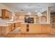 Kitchen featuring granite countertops, stainless steel appliances, a center island and wooden cabinets at 3015 Duneville St, Las Vegas, NV 89146