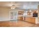Open kitchen featuring a center island with granite countertops, wine rack and stainless appliances at 3015 Duneville St, Las Vegas, NV 89146