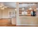 View from living area into the kitchen with granite countertops and wood cabinets at 3015 Duneville St, Las Vegas, NV 89146