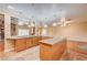 Open kitchen with an island, granite countertops and recessed lighting overlooking a living space at 3015 Duneville St, Las Vegas, NV 89146