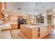 Spacious kitchen featuring a center island with granite countertops, pendant lights, and stainless appliances at 3015 Duneville St, Las Vegas, NV 89146
