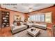Virtually staged living room featuring modern furniture, hardwood floors and neutral paint at 3015 Duneville St, Las Vegas, NV 89146
