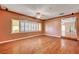 Bright living room with hardwood floors and large window with custom shutters at 3015 Duneville St, Las Vegas, NV 89146
