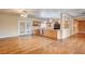 Living room featuring hardwood floors and views into the kitchen with a large island at 3015 Duneville St, Las Vegas, NV 89146