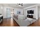 Spacious living room with hardwood floors, large sectional sofa, recessed lighting, and slider doors at 3239 Robins Creek Pl, Las Vegas, NV 89135