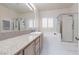 Large main bathroom with a dual shower, large tub, and plenty of granite counter space at 3239 Robins Creek Pl, Las Vegas, NV 89135