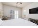 Relaxing main bedroom with a bed, ceiling fan, and easy access to an en-suite bathroom at 3239 Robins Creek Pl, Las Vegas, NV 89135