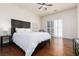 Spacious main bedroom with a bed, ceiling fan, and sliding door access to outdoor area at 3239 Robins Creek Pl, Las Vegas, NV 89135