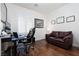 Comfortable office space with hardwood floors, desk, and seating, perfect for remote work at 3239 Robins Creek Pl, Las Vegas, NV 89135