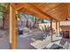 Outdoor patio featuring stone pavers, a built-in grill, and a spacious covered area for entertaining at 3257 Coral Harbor Dr, Las Vegas, NV 89117