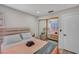 Charming bedroom featuring mirrored closet doors, cozy bedding, and ample natural light, ideal for relaxation at 3257 Coral Harbor Dr, Las Vegas, NV 89117