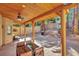 Inviting covered patio with wood beams, ceiling fan, and outdoor dining area at 3257 Coral Harbor Dr, Las Vegas, NV 89117