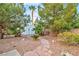 The backyard has a storage shed and mature trees, including a palm at 3334 W Mardon Ave, Las Vegas, NV 89139