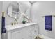 Bathroom with double sink vanity, decorative mirrors and gold hardware at 3334 W Mardon Ave, Las Vegas, NV 89139