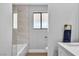 Modern bathroom with a view out a frosted window and gold plumbing fixtures at 3334 W Mardon Ave, Las Vegas, NV 89139