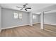 Spacious bedroom with ceiling fan, large windows, and mirrored closet doors at 3334 W Mardon Ave, Las Vegas, NV 89139