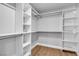Walk-in closet featuring built-in shelving and wood flooring at 3334 W Mardon Ave, Las Vegas, NV 89139