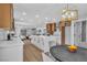 Open kitchen and dining area with island, light fixture, and modern finishes at 3334 W Mardon Ave, Las Vegas, NV 89139