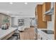 Open kitchen with an island, stainless steel appliances, and wood cabinets at 3334 W Mardon Ave, Las Vegas, NV 89139