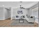 Comfortable living room showcasing modern decor, wood floors, and an abundance of natural light at 3334 W Mardon Ave, Las Vegas, NV 89139