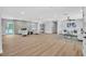 Spacious open-concept living area with a cozy fireplace, modern seating, and seamless access to outdoor pool at 3334 W Mardon Ave, Las Vegas, NV 89139