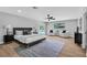 This bright main bedroom has wood floors, ceiling fan and an exit to the backyard and pool at 3334 W Mardon Ave, Las Vegas, NV 89139