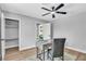 Well lit office with a ceiling fan, modern desk, and a view out the window at 3334 W Mardon Ave, Las Vegas, NV 89139