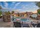 Stunning backyard with a pool, spa, water feature, gazebo, and plenty of seating for entertaining at 3334 W Mardon Ave, Las Vegas, NV 89139
