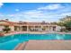 A beautiful backyard pool with a covered patio and well-maintained landscaping at 3334 W Mardon Ave, Las Vegas, NV 89139