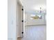 Bedroom with wood-look flooring, modern light fixture, and bright natural light at 3339 Duece St, Las Vegas, NV 89121