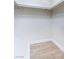 Empty walk-in closet with white walls and wood floor at 3339 Duece St, Las Vegas, NV 89121