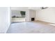 Spacious living room with a fireplace, ceiling fan, sliding glass door to backyard, and light wood-look floors at 3339 Duece St, Las Vegas, NV 89121