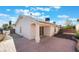 An elegant home featuring a covered patio and textured concrete in the backyard at 3517 S Dapple Gray Rd, Las Vegas, NV 89147