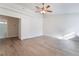 Bright bedroom featuring a ceiling fan and light wood-look floors at 3517 S Dapple Gray Rd, Las Vegas, NV 89147