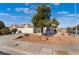Front exterior of a home with desert landscaping and an attached two-car garage at 3517 S Dapple Gray Rd, Las Vegas, NV 89147
