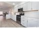 Modern kitchen featuring white cabinets, stainless steel appliances, and plenty of countertop space at 3517 S Dapple Gray Rd, Las Vegas, NV 89147