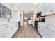 Contemporary kitchen featuring quartz countertops, stainless steel appliances, and an open view to the living room at 3517 S Dapple Gray Rd, Las Vegas, NV 89147