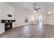 Open-concept living room with fireplace and view of the kitchen at 3517 S Dapple Gray Rd, Las Vegas, NV 89147