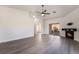 Spacious living room featuring a fireplace, ceiling fan, and sliding glass doors to the backyard at 3517 S Dapple Gray Rd, Las Vegas, NV 89147