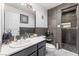 Bathroom with a single vanity, a toilet and a step-in shower featuring a modern tile at 3661 Margarita Way, Las Vegas, NV 89103