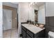Bathroom featuring a single vanity and access to a shower and a large walk-in closet at 3661 Margarita Way, Las Vegas, NV 89103