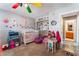 Cozy bedroom features a crib, playful decor, and an attached bathroom at 3661 Margarita Way, Las Vegas, NV 89103