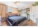 Cozy bedroom featuring a ceiling fan, a window with natural light and built-in storage shelves at 3661 Margarita Way, Las Vegas, NV 89103