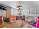 Bright and cheerful bedroom with toys, playful decor, and a colorful ceiling fan at 3661 Margarita Way, Las Vegas, NV 89103