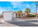 Charming single-story home featuring a two car garage and desert landscaping with mature palms at 3661 Margarita Way, Las Vegas, NV 89103