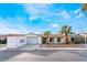 Charming single-story home featuring a two car garage and desert landscaping with mature palms at 3661 Margarita Way, Las Vegas, NV 89103