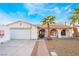 Charming single-story home featuring a two car garage and desert landscaping with mature palms at 3661 Margarita Way, Las Vegas, NV 89103