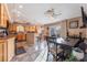 Eat-in kitchen showcasing tile flooring, warm lighting and a breakfast bar, perfect for casual dining at 3661 Margarita Way, Las Vegas, NV 89103
