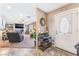 Bright living room flows from entry, featuring tile floors and carpeted living room with fireplace at 3661 Margarita Way, Las Vegas, NV 89103